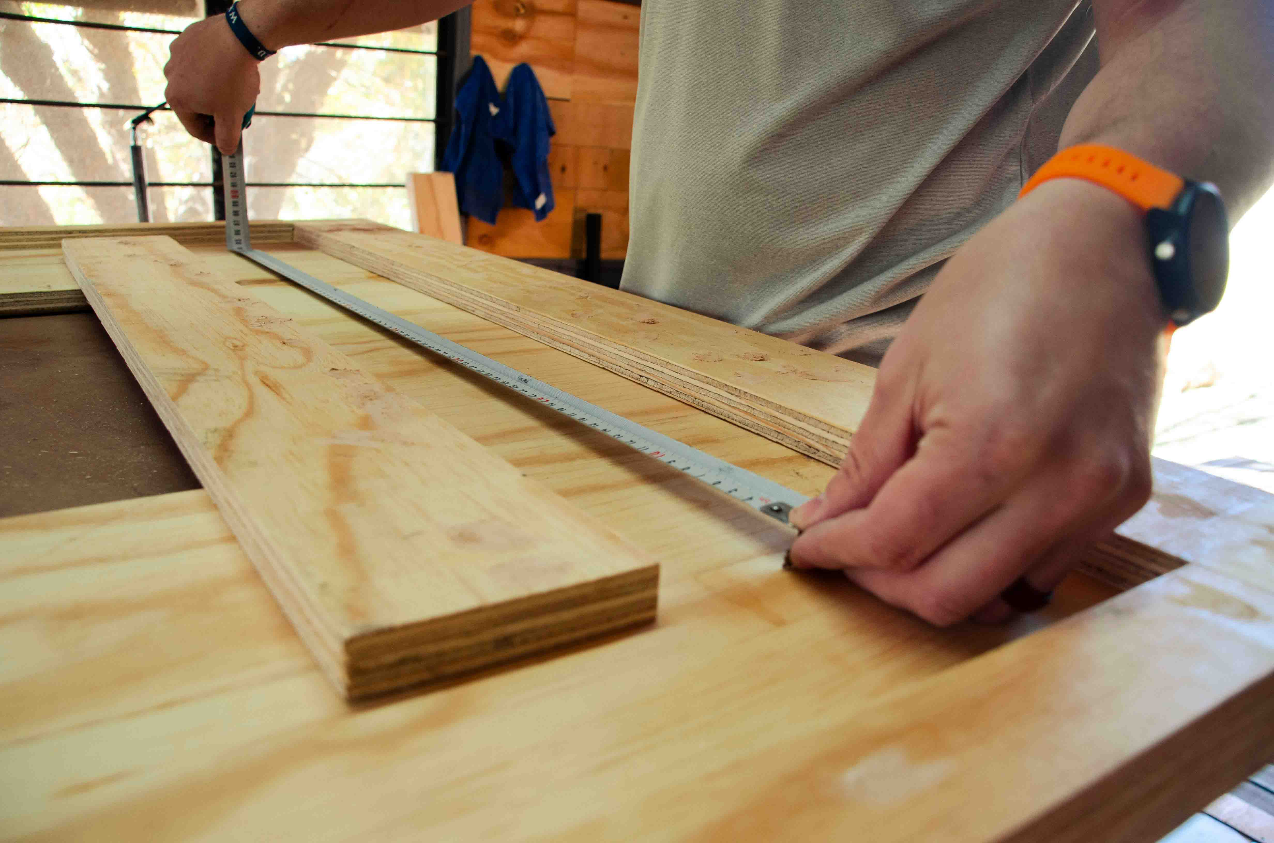 Professional joiner in Baddiley measuring wood with precision tools